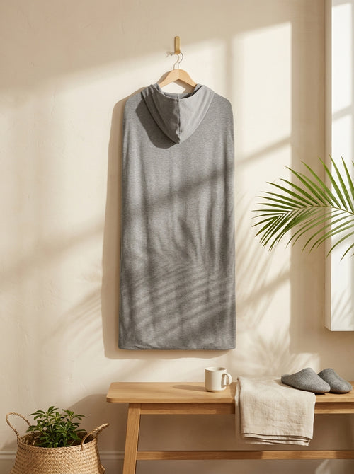 The Hooded Cocoon Blanket hanging full length in a sunlit room